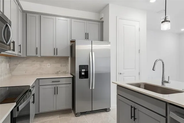 a kitchen with a sink and cabinets