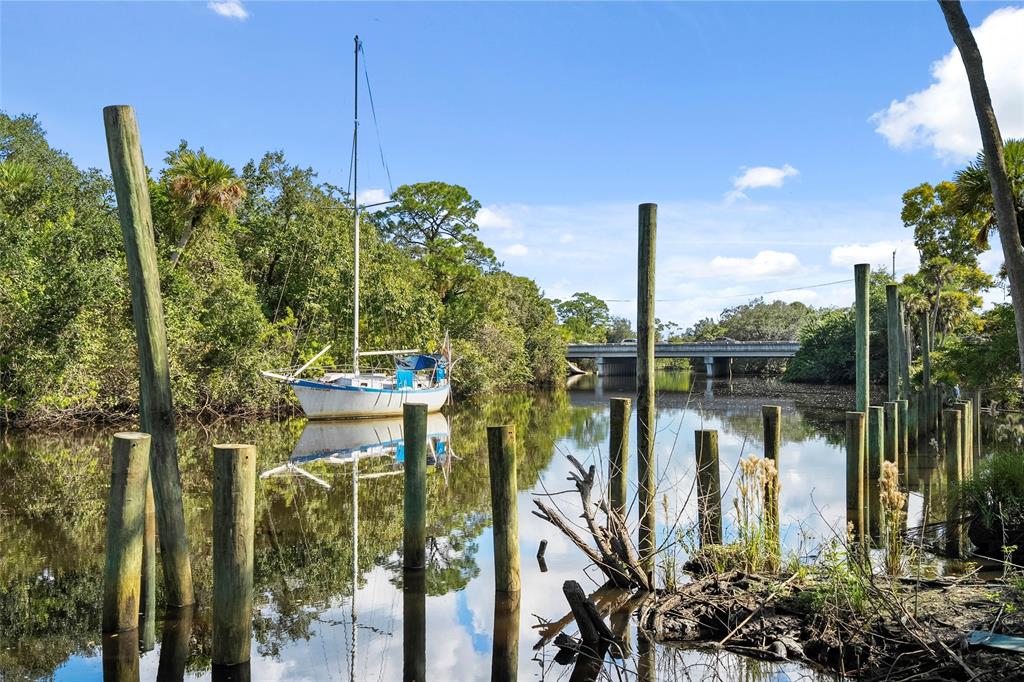 285 Southwest Sally Way Stuart, FL 34997 - Photo 41 of 48 a front view of a house with a lake view