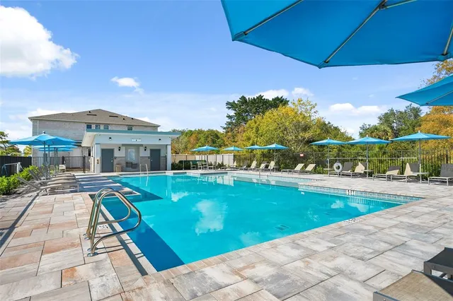 a view of a house with backyard porch and furniture