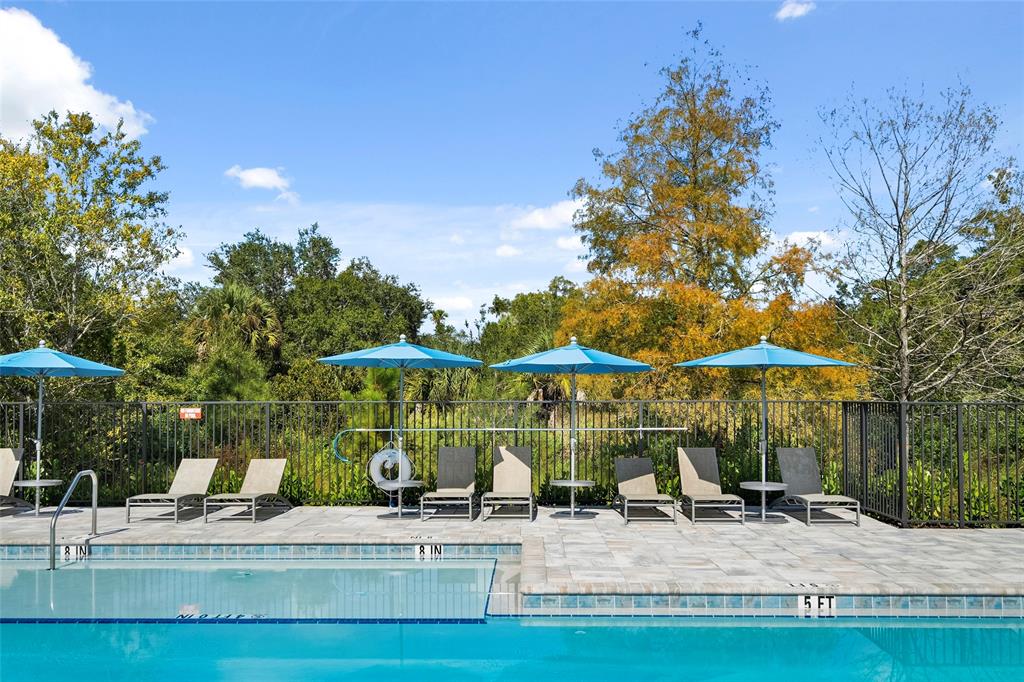 285 Southwest Sally Way Stuart, FL 34997 - Photo 45 of 48 a view of a house with backyard porch and furniture