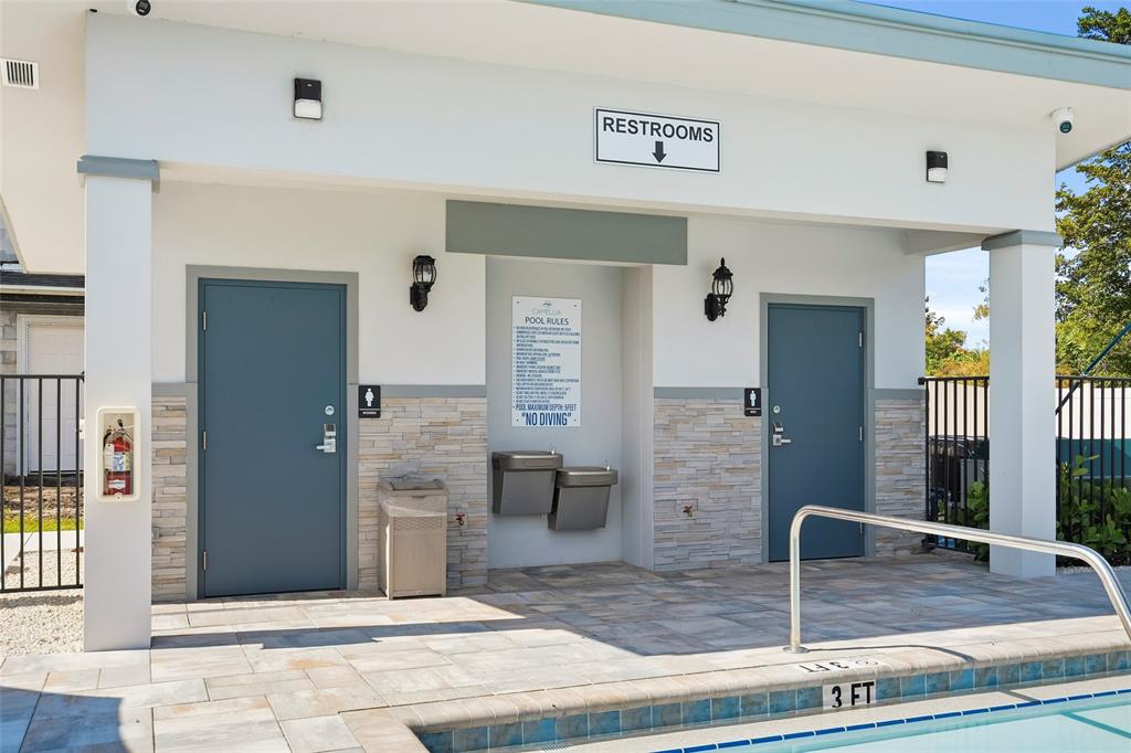 285 Southwest Sally Way Stuart, FL 34997 - Photo 46 of 48 a view of a hallway with wooden floor and windows