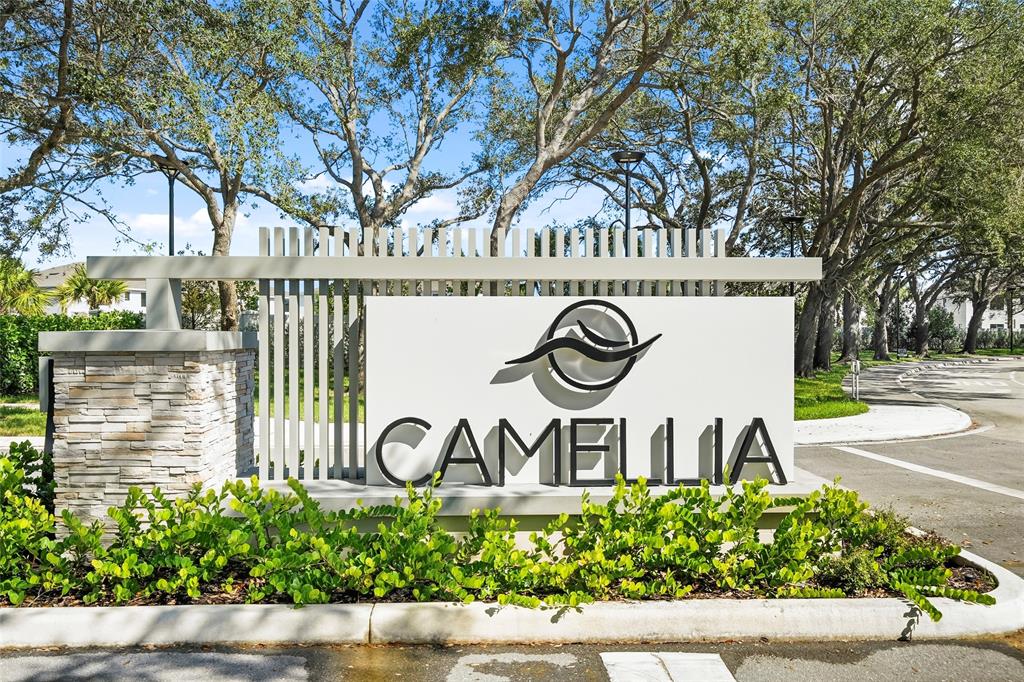 285 Southwest Sally Way Stuart, FL 34997 - Photo 48 of 48 a view of sign board with flower plants