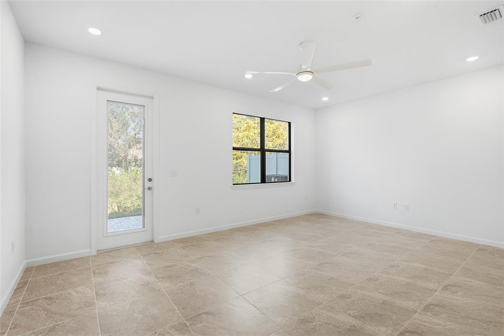 285 Southwest Sally Way Stuart, FL 34997 - Photo 9 of 48 an empty room with windows and closet