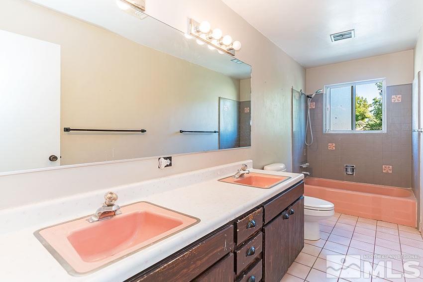 1595 Belford Road Reno, NV 89509 - Photo 13 of 21 a bathroom with a sink double vanity and a mirror