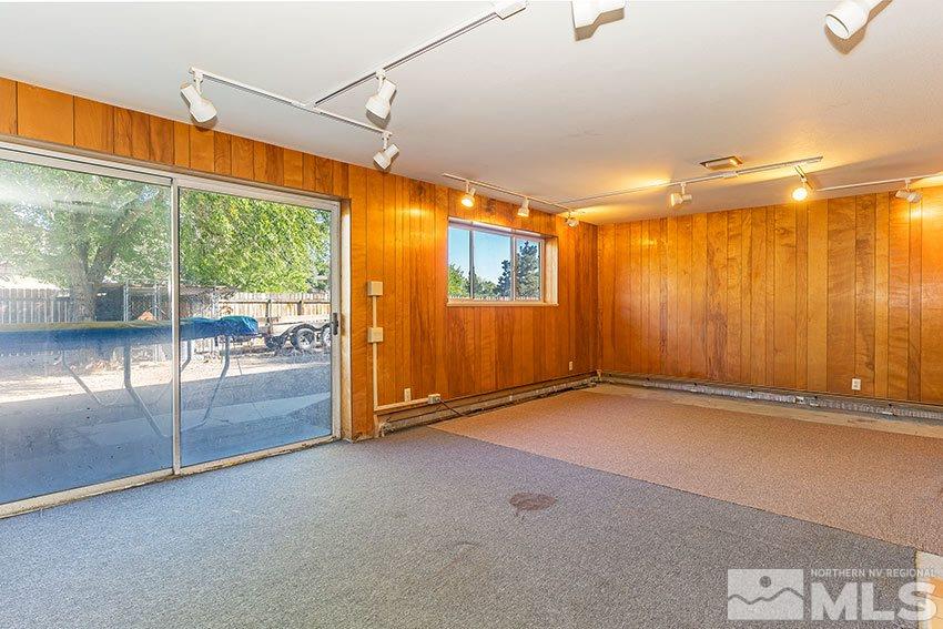 1595 Belford Road Reno, NV 89509 - Photo 14 of 21 an empty room with sliding door and wooden floor