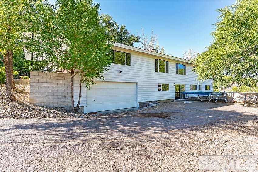 1595 Belford Road Reno, NV 89509 - Photo 19 of 21 a front view of a house with a yard