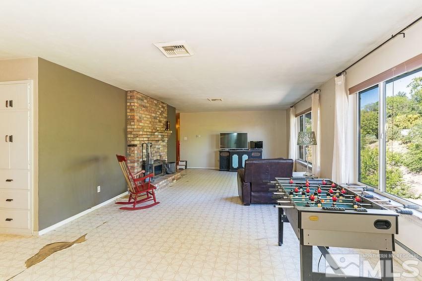 1595 Belford Road Reno, NV 89509 - Photo 4 of 21 a living room with furniture and a large window