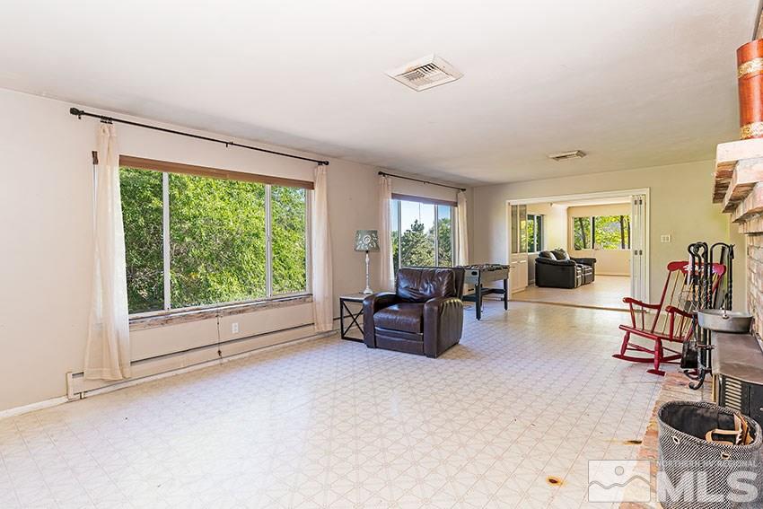 1595 Belford Road Reno, NV 89509 - Photo 5 of 21 a living room with furniture and a large window
