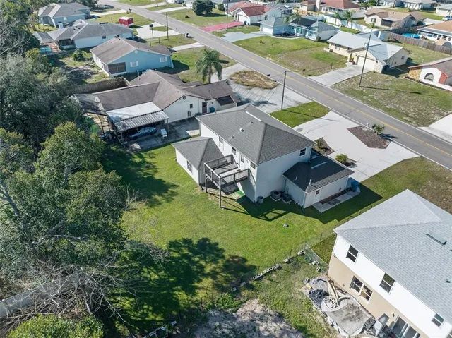 an aerial view of a house with a garden