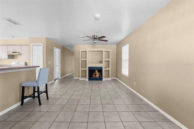 a view of kitchen with furniture and window