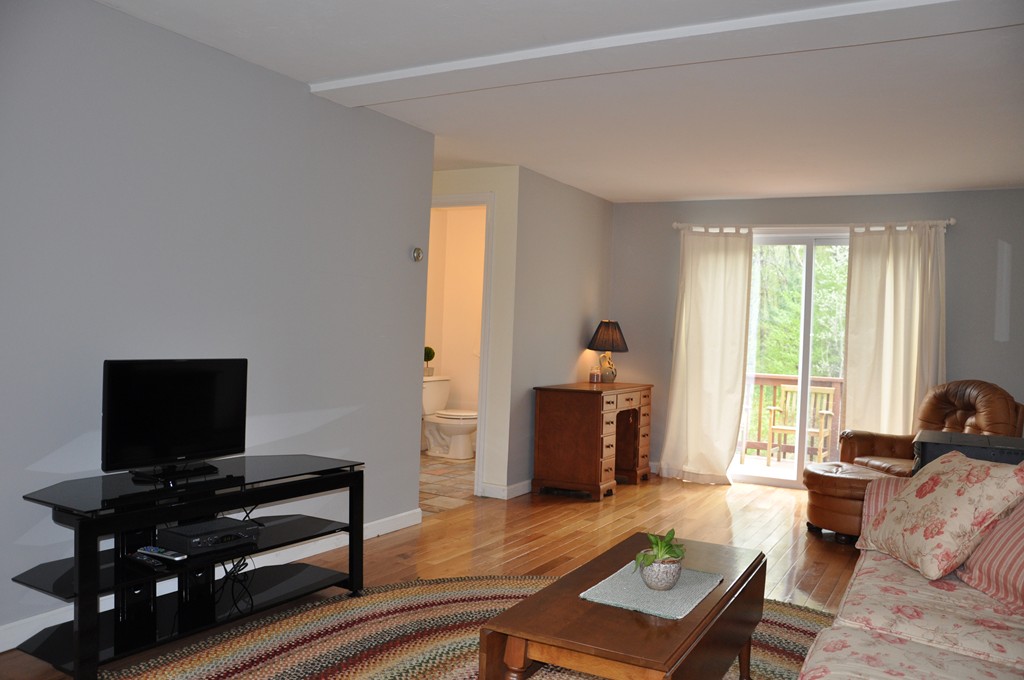 69 Haggerty Road Charlton, MA 01507 - Photo 12 of 30 a living room with furniture and a flat screen tv
