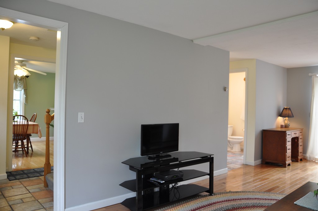 69 Haggerty Road Charlton, MA 01507 - Photo 14 of 30 a living room with furniture and a flat screen tv