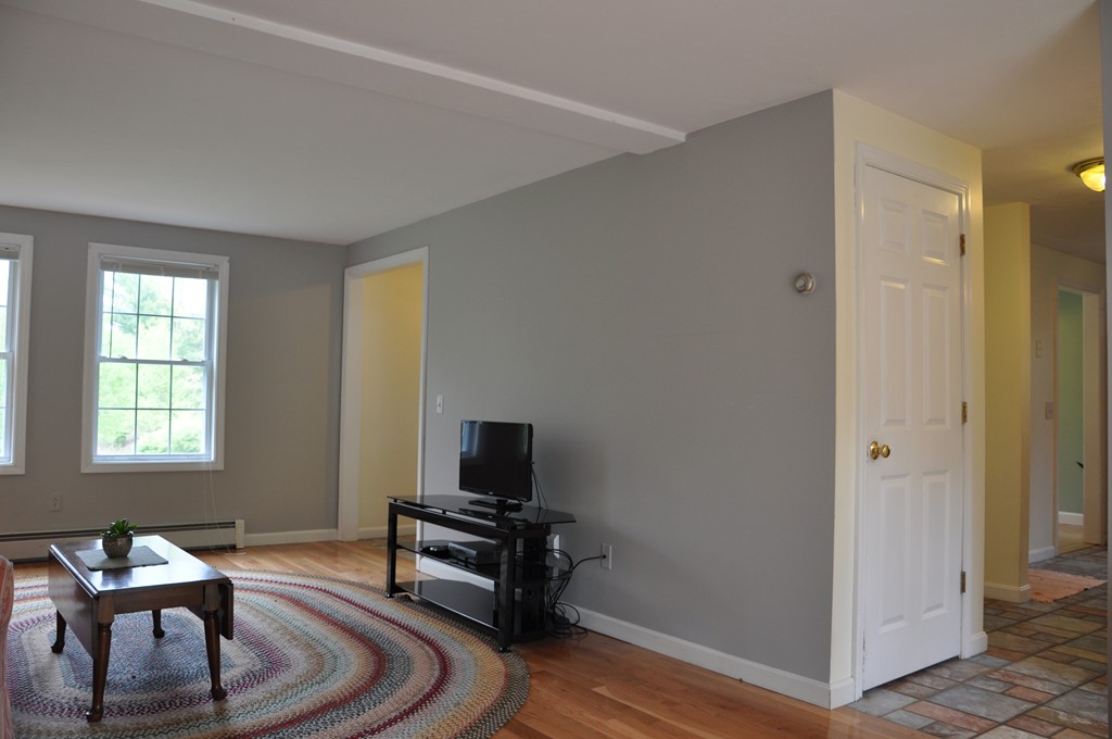 69 Haggerty Road Charlton, MA 01507 - Photo 16 of 30 a living room with furniture and a flat screen tv