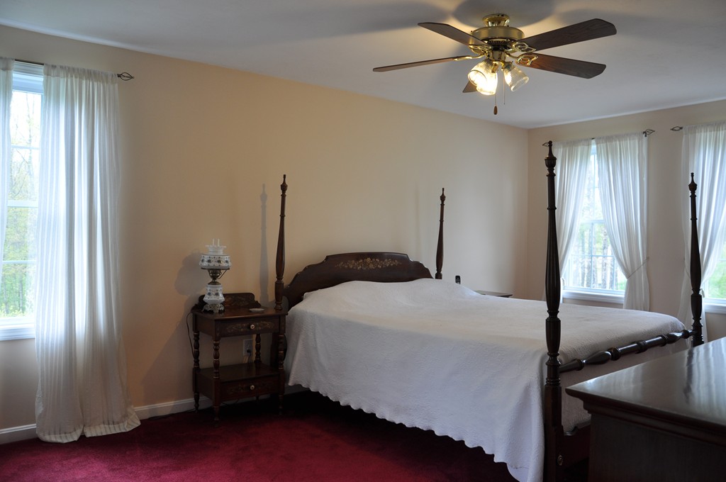 69 Haggerty Road Charlton, MA 01507 - Photo 17 of 30 a bedroom with a bed and a window