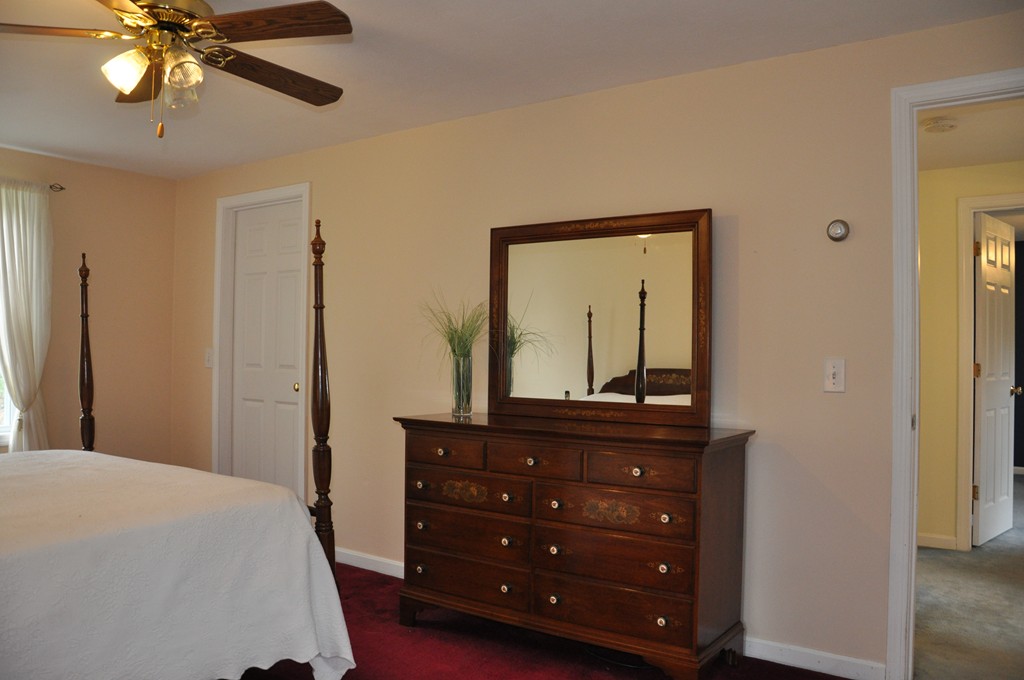 69 Haggerty Road Charlton, MA 01507 - Photo 18 of 30 a bedroom with a bed and a dresser