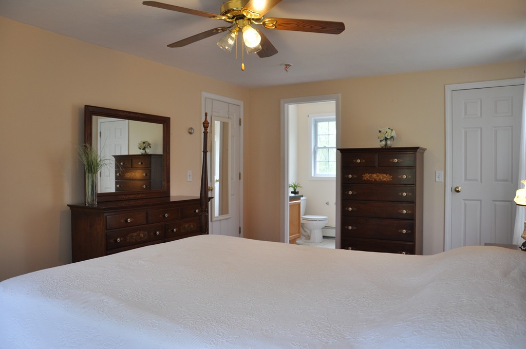 69 Haggerty Road Charlton, MA 01507 - Photo 19 of 30 a bedroom with a bed and a dresser