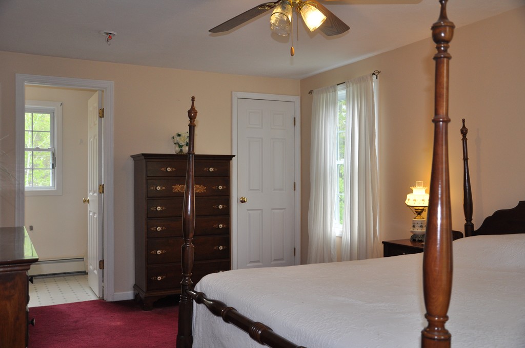 69 Haggerty Road Charlton, MA 01507 - Photo 20 of 30 a bedroom with a bed and a dresser