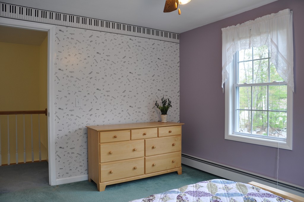 69 Haggerty Road Charlton, MA 01507 - Photo 26 of 30 a room with a dresser and a window