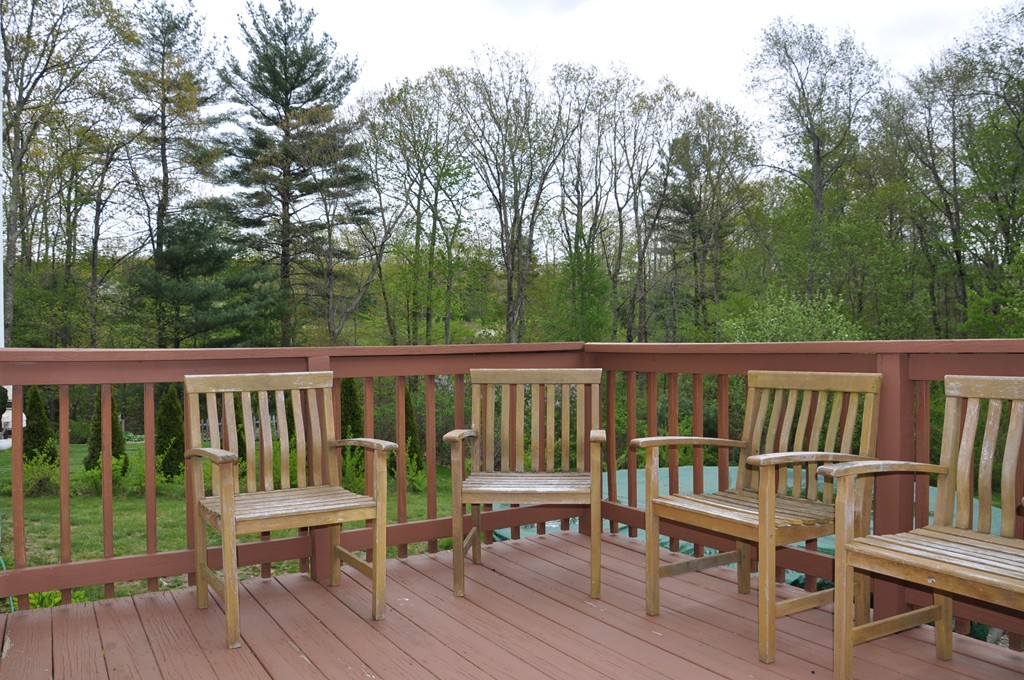 69 Haggerty Road Charlton, MA 01507 - Photo 27 of 30 a view of a wooden deck with furniture