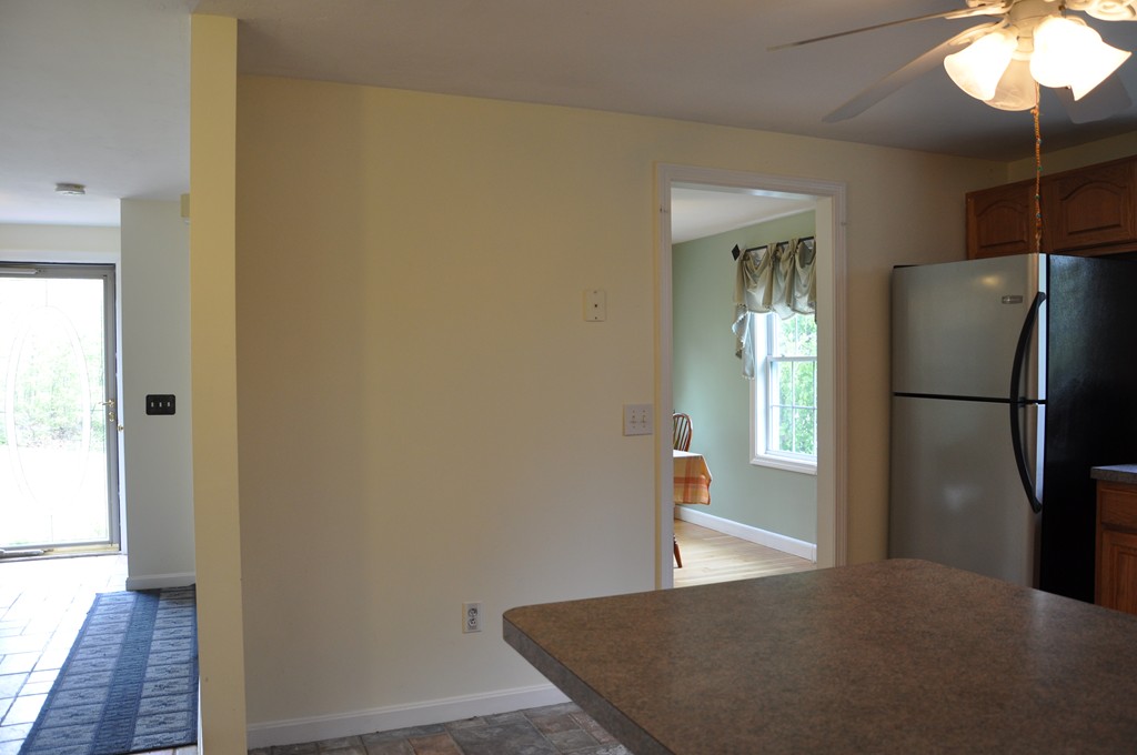69 Haggerty Road Charlton, MA 01507 - Photo 3 of 30 a view of a kitchen with wooden floor and a window