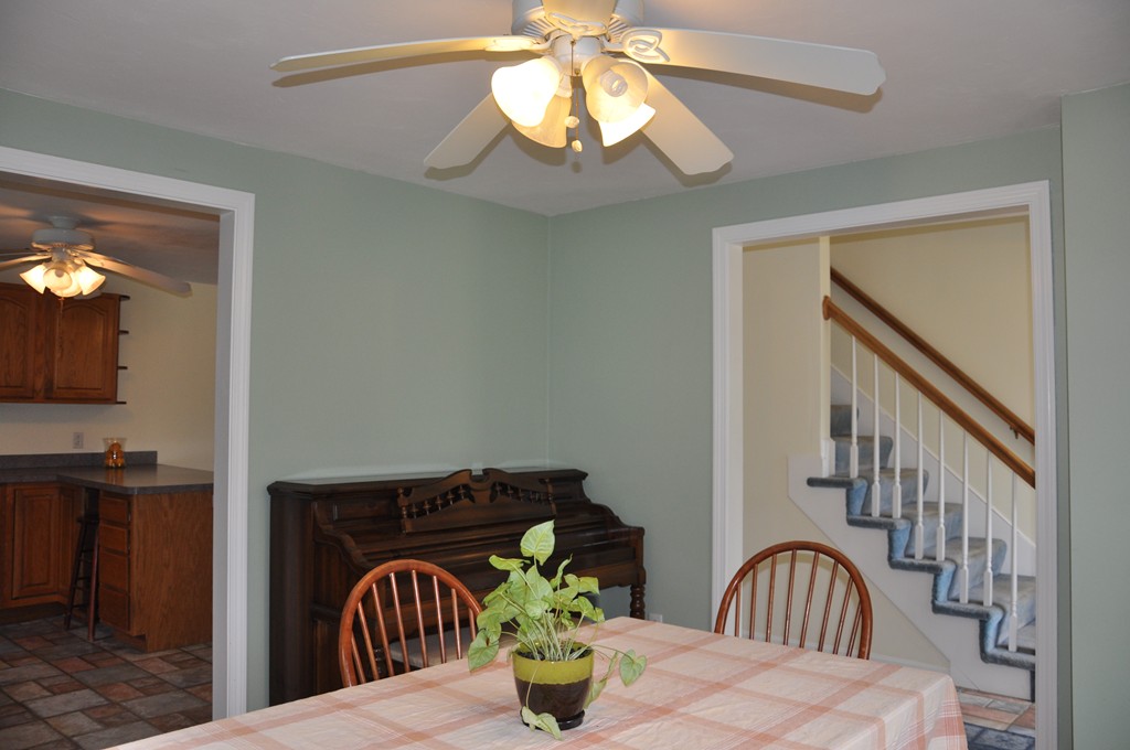 69 Haggerty Road Charlton, MA 01507 - Photo 8 of 30 a view of a dining room with a table and chairs