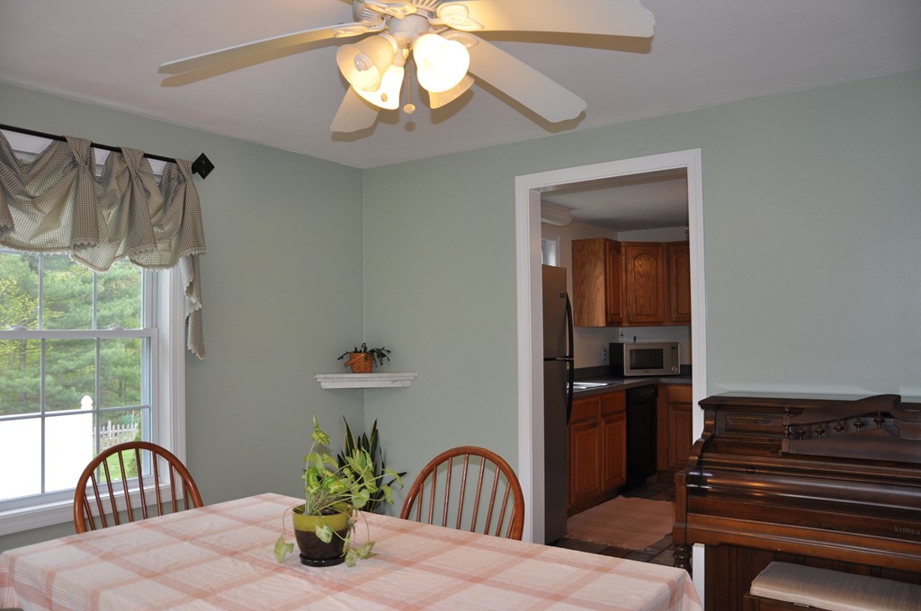 69 Haggerty Road Charlton, MA 01507 - Photo 9 of 30 a bedroom with a bed and a chandelier