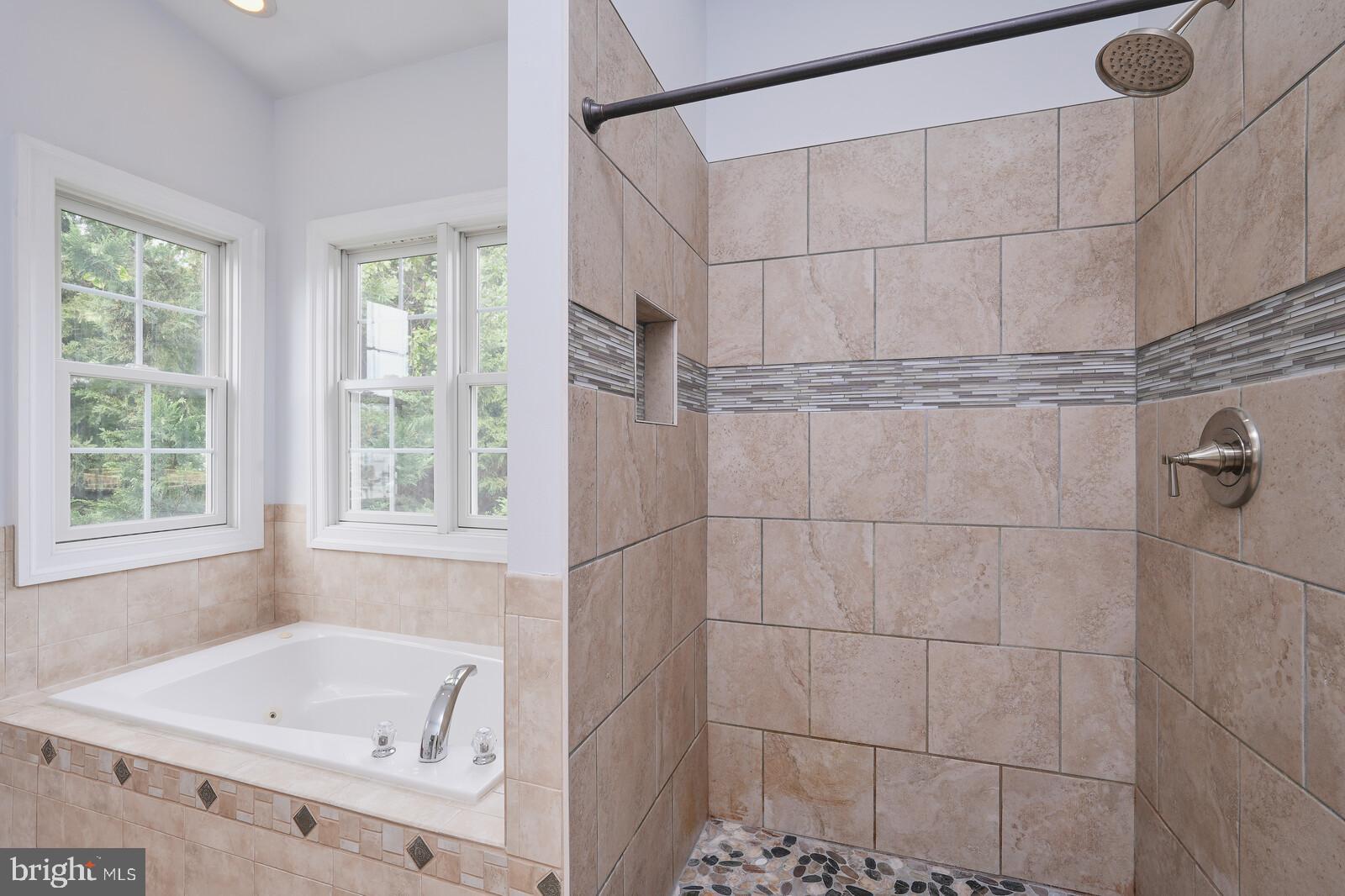 304 South Camp Meade Road Linthicum Heights, MD 21090 - Photo 19 of 43 a bathroom with a tub and shower