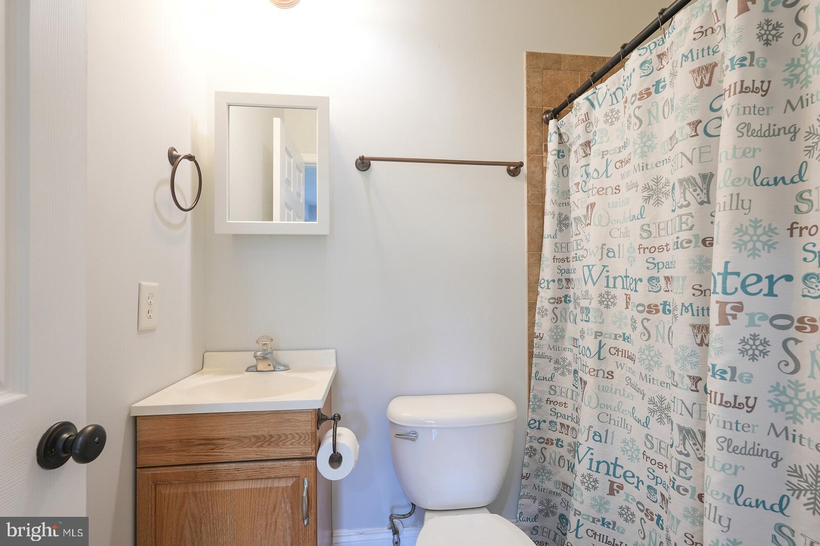 304 South Camp Meade Road Linthicum Heights, MD 21090 - Photo 29 of 43 a bathroom with a toilet sink and mirror