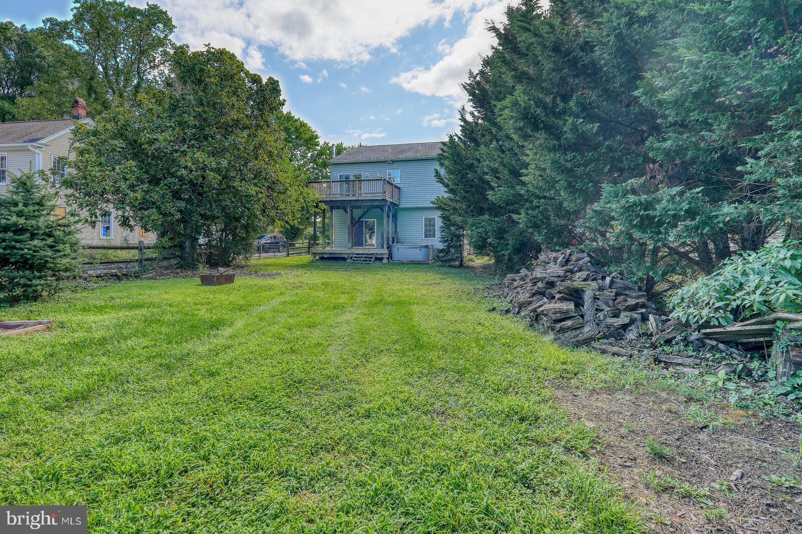 304 South Camp Meade Road Linthicum Heights, MD 21090 - Photo 39 of 43 a view of a big yard with plants and large trees