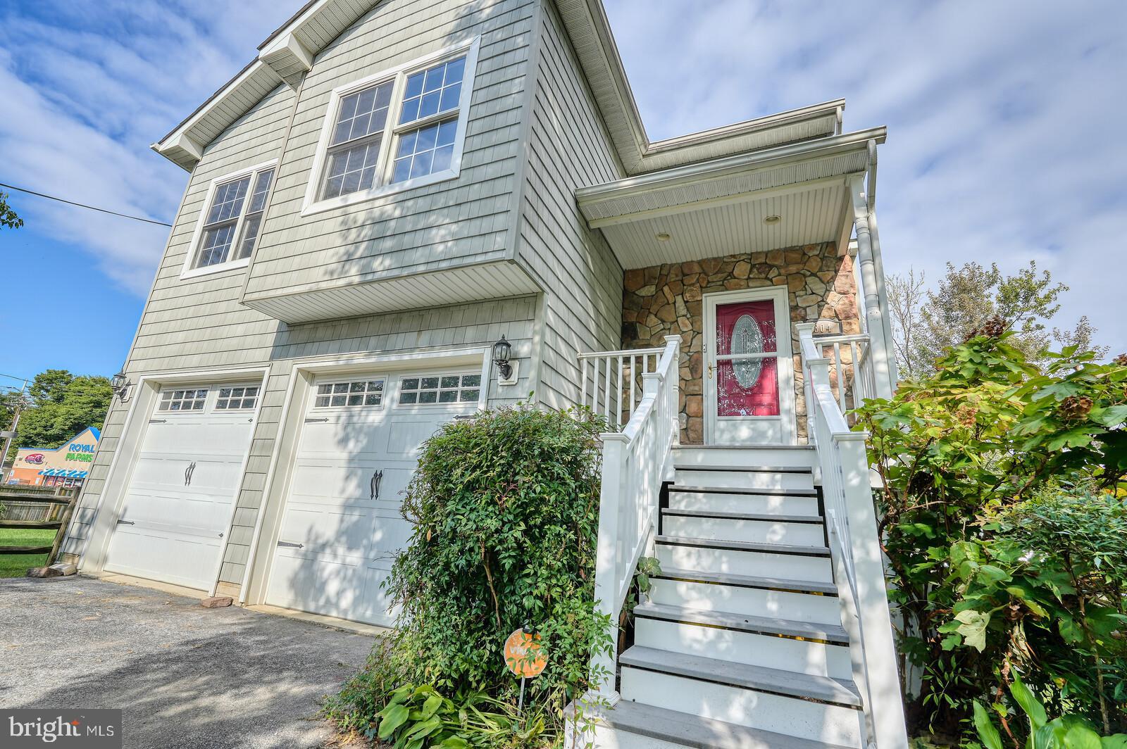 304 South Camp Meade Road Linthicum Heights, MD 21090 - Photo 4 of 43 a front view of a house with a potted plant