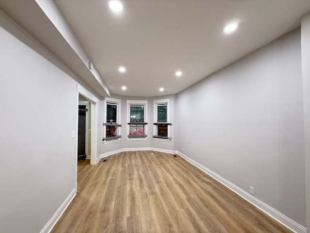 7045 South Prairie Avenue Chicago, IL 60637 - Photo 3 of 11 a view of a livingroom with a hall and wooden floor