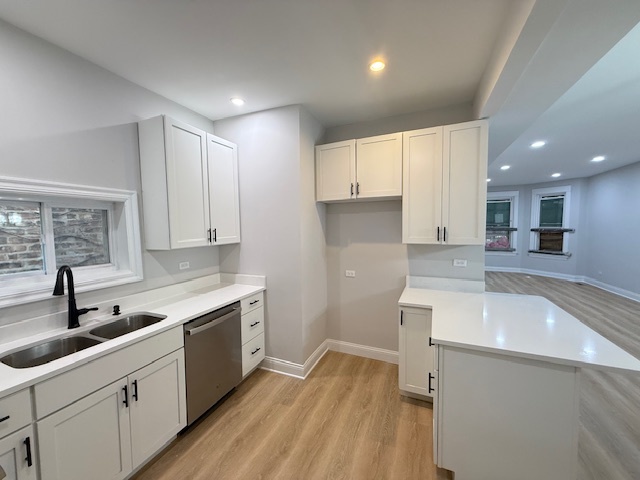 7045 South Prairie Avenue Chicago, IL 60637 - Photo 5 of 11 a kitchen with a sink stove and cabinets