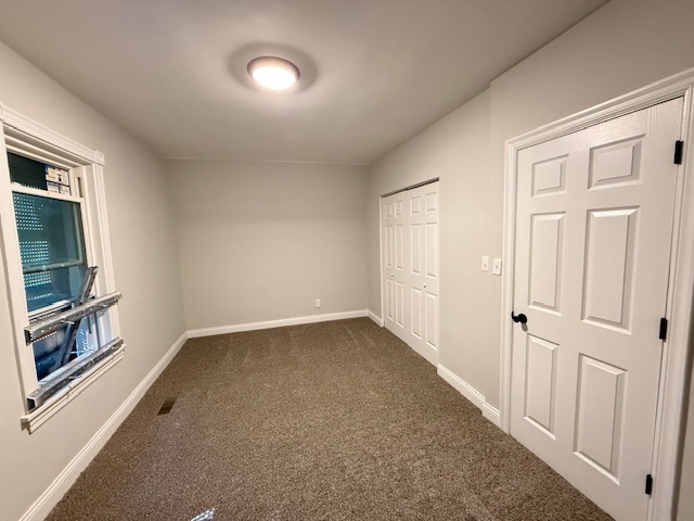 7045 South Prairie Avenue Chicago, IL 60637 - Photo 7 of 11 en empty room with windows