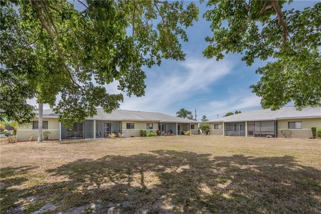 25225 Rampart Boulevard, Unit 1301 Punta Gorda, FL 33983 - Photo 14 of 19 a front view of a house with a yard
