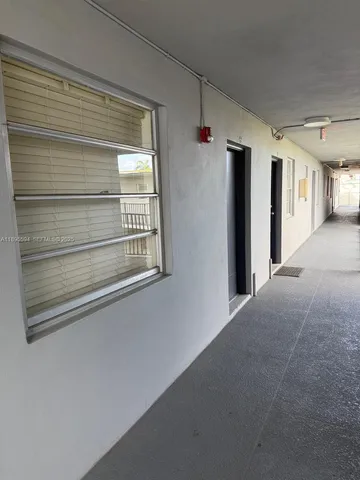 a view of a hallway with closet