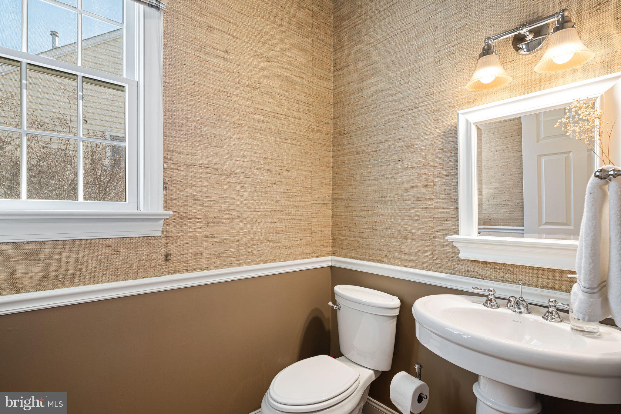 417 East Summit Avenue Haddonfield, NJ 08033 - Photo 13 of 34 a bathroom with a sink a toilet and mirror