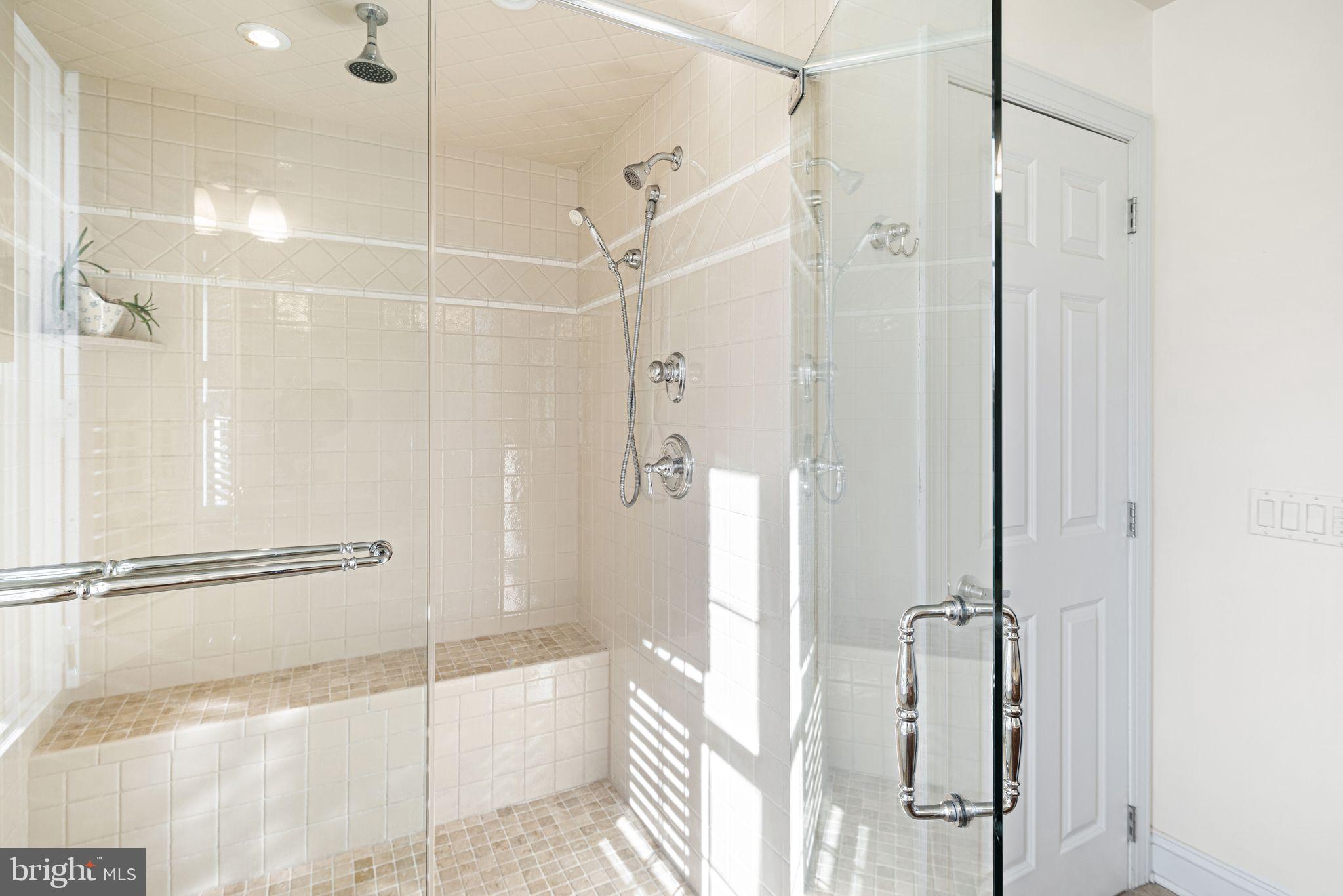 417 East Summit Avenue Haddonfield, NJ 08033 - Photo 18 of 34 a bathroom with a shower and a glass door