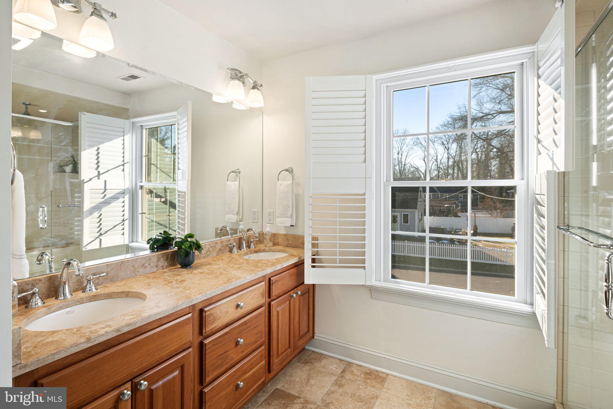 417 East Summit Avenue Haddonfield, NJ 08033 - Photo 19 of 34 a bathroom with a sink double vanity and a large mirror