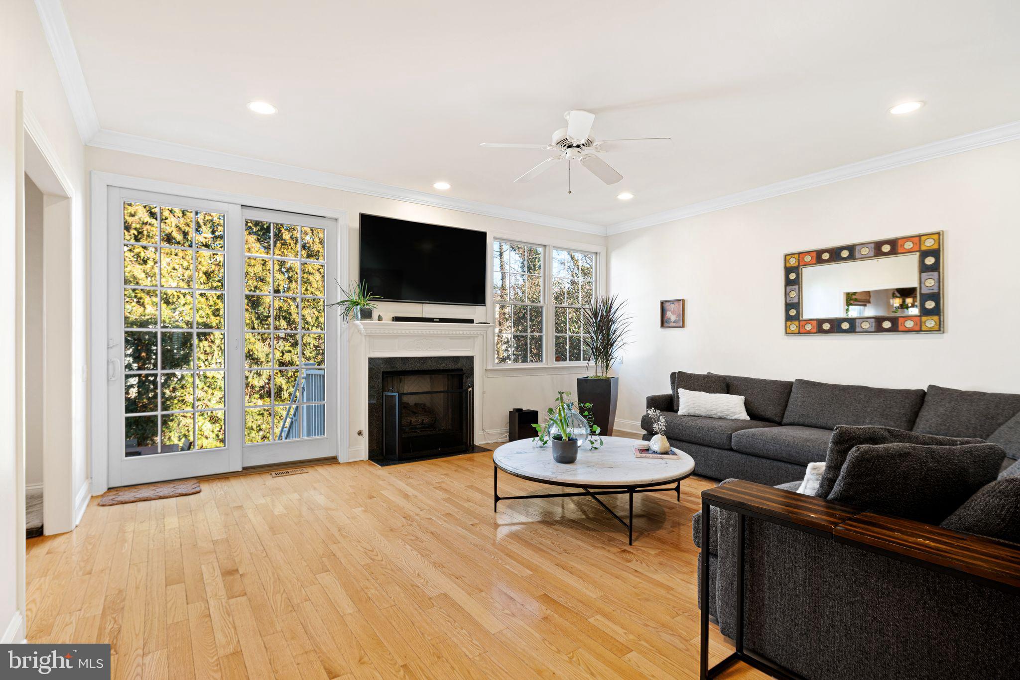 417 East Summit Avenue Haddonfield, NJ 08033 - Photo 2 of 34 a living room with furniture a fireplace and a flat screen tv