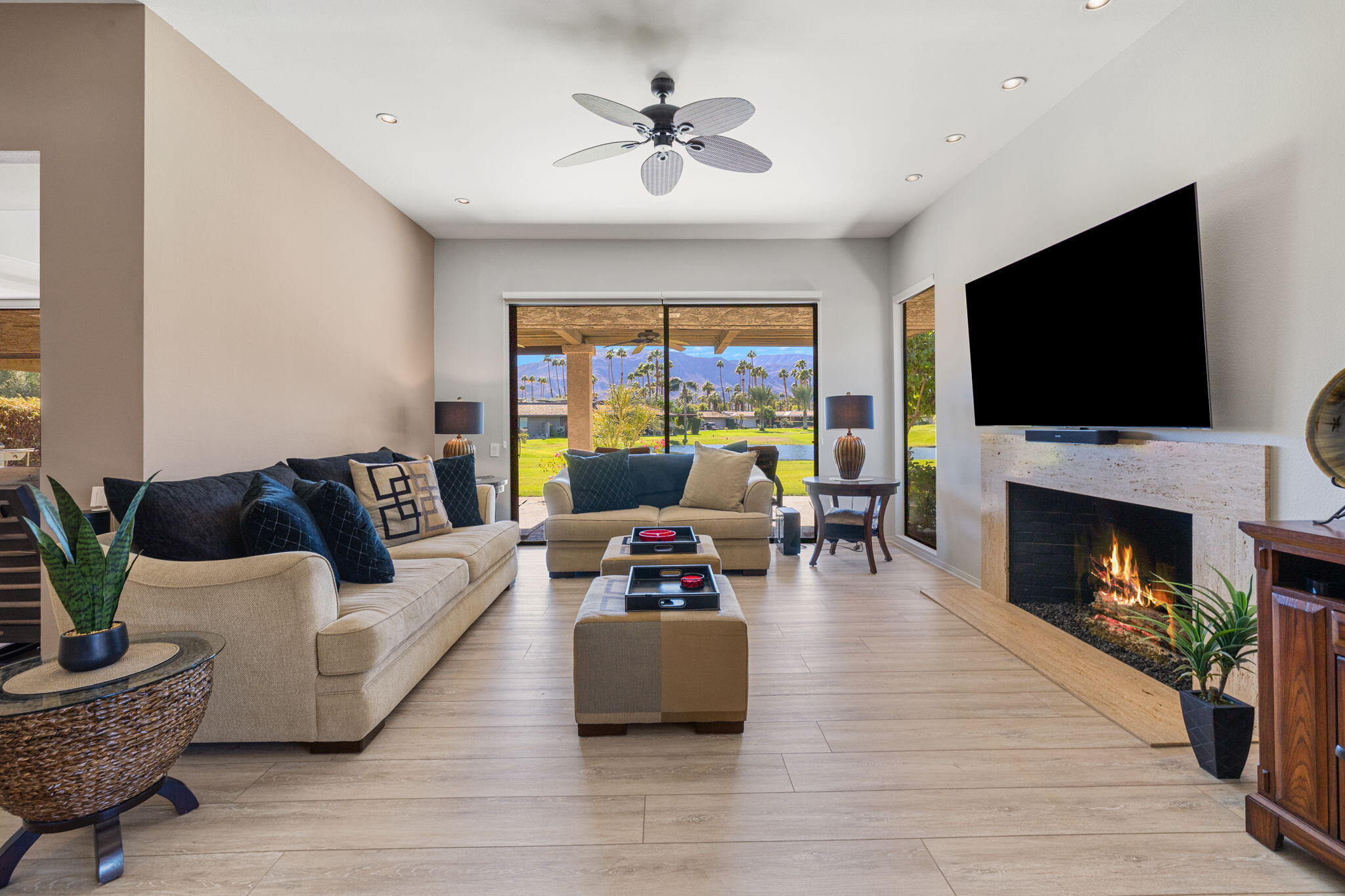 11 Reed Court Rancho Mirage, CA 92270 - Photo 14 of 59 a living room with furniture a fireplace and a flat screen tv