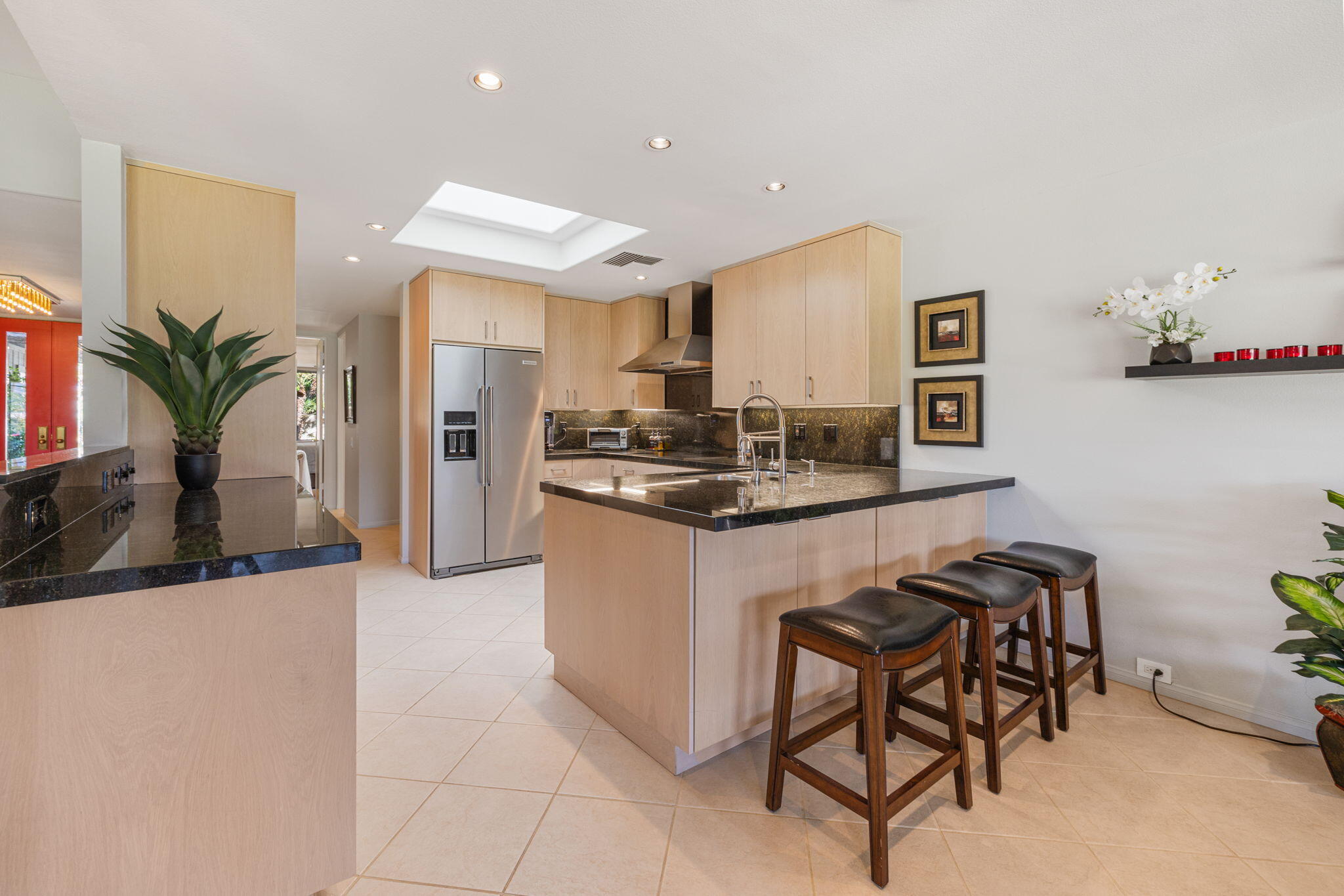 11 Reed Court Rancho Mirage, CA 92270 - Photo 23 of 59 a kitchen with stainless steel appliances granite countertop a table and chairs in it