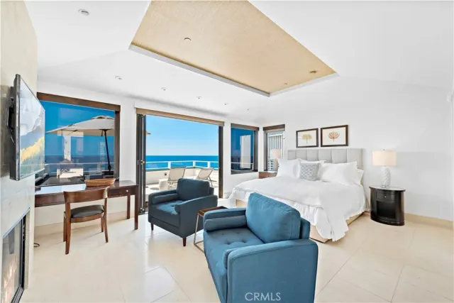 a bedroom with furniture and a fireplace