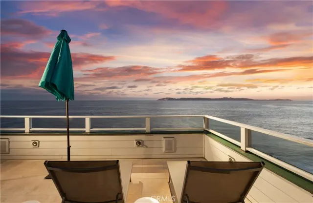 a view of roof deck with two chairs