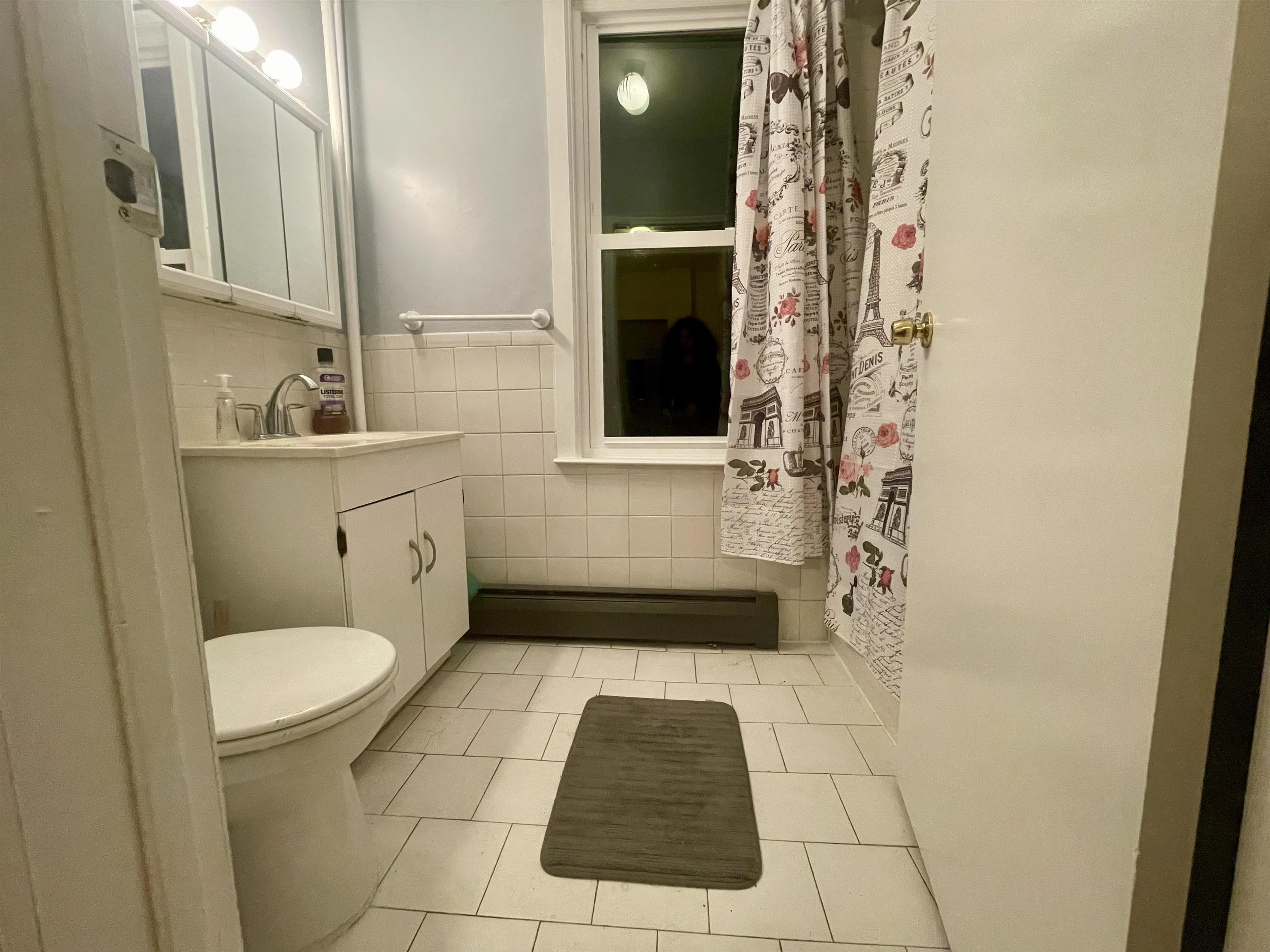 421 Adams Street, Unit 2L Hoboken, NJ 07030 - Photo 10 of 19 a bathroom with a toilet and a shower