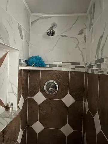 a white toilet sitting next to a sink