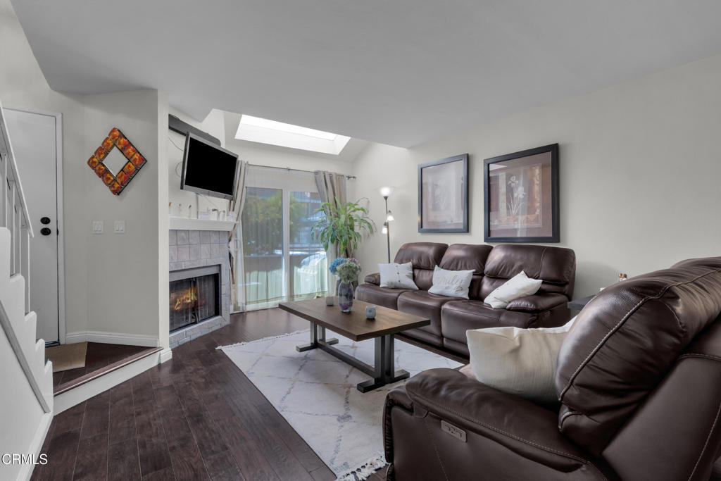 19431 Sherman Way, Unit 6 Reseda, CA 91335 - Photo 20 of 31 a living room with furniture and a fireplace