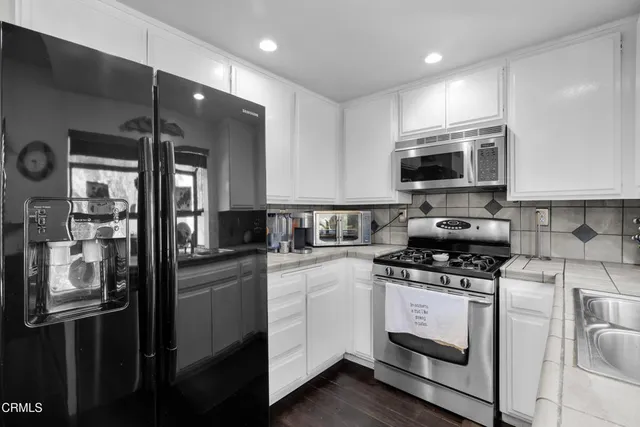 a bathroom with a sink double vanity and a shower