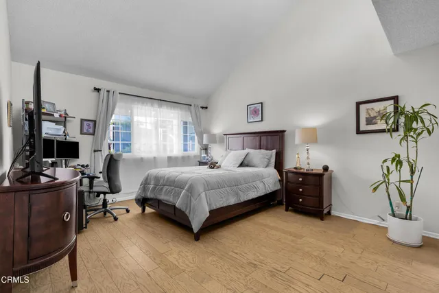 a bedroom with a bed and a couch