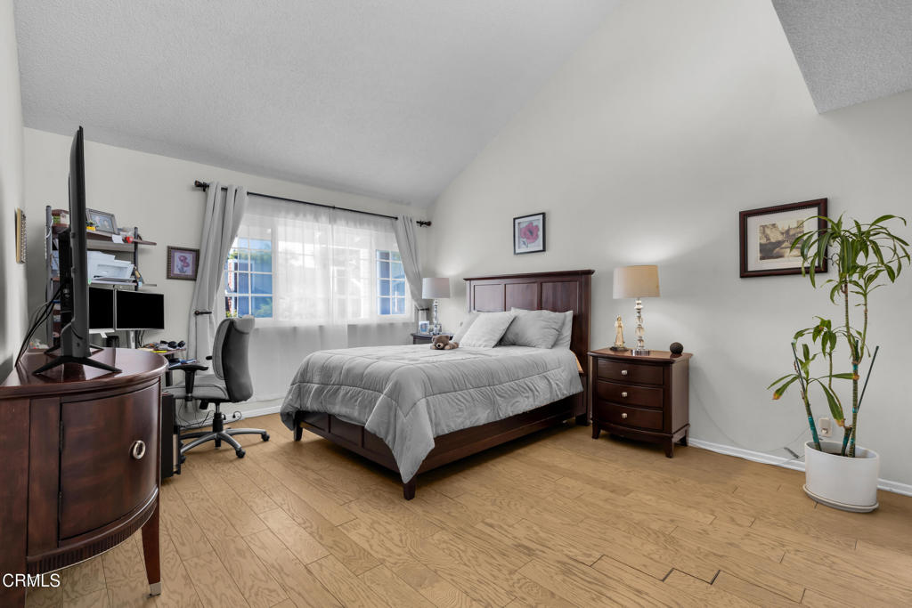 19431 Sherman Way, Unit 6 Reseda, CA 91335 - Photo 4 of 31 a bedroom with a bed and a couch