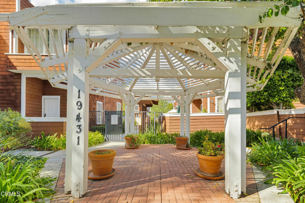 19431 Sherman Way, Unit 6 Reseda, CA 91335 - Photo 7 of 31 a view of a building with potted plants